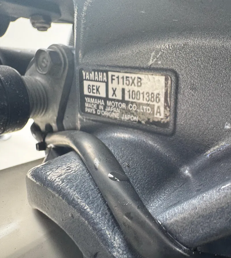 Slide: The Image of Close-up of Yamaha F115XB engine label on 2015 Cobia 237 Center Console boat. - 36