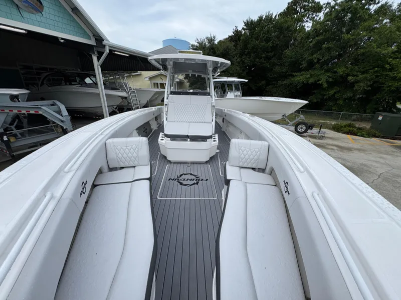 Slide: The Image of 2022 Fountain 38 CC boat with sleek white interior and spacious seating. - 22