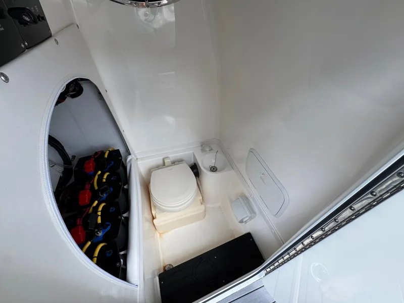 Slide: The Image of 2022 Fountain 38 CC boat interior with toilet and battery compartment. - 26