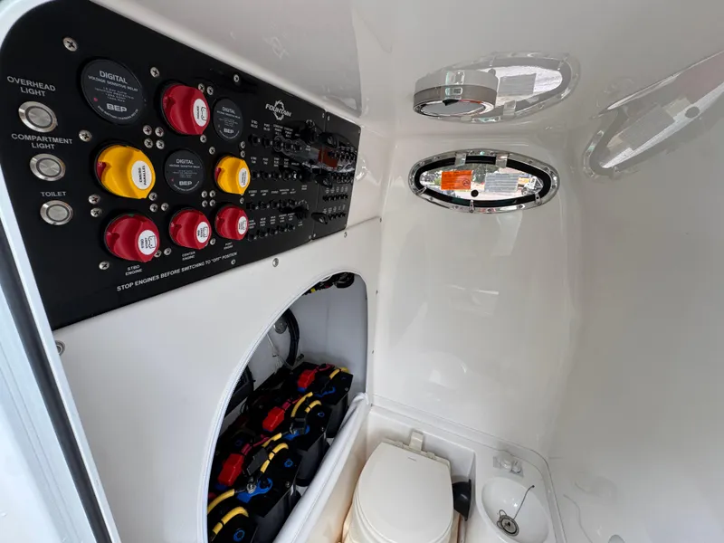 Slide: The Image of Control panel and toilet inside 2022 Fountain 38 CC boat cabin. - 27