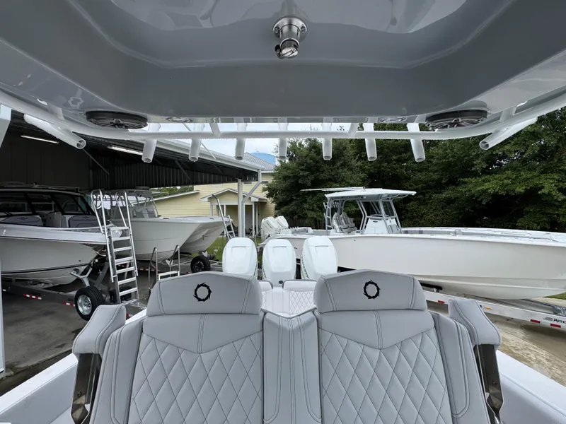 Slide: The Image of 2022 Fountain 38 CC boat interior with luxurious seating and multiple engines. - 30
