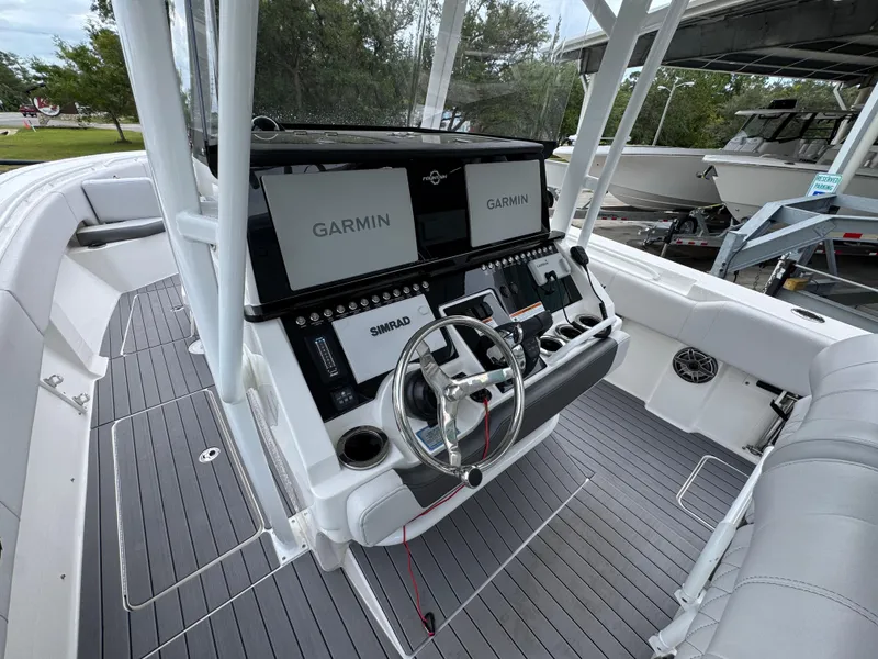 Slide: The Image of 2022 Fountain 38 CC boat cockpit with Garmin and Simrad displays. - 31