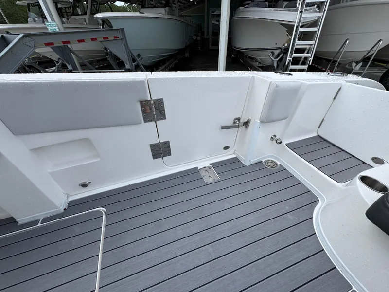 Slide: The Image of 2022 Fountain 38 CC boat deck with sleek, modern design and gray flooring. - 39