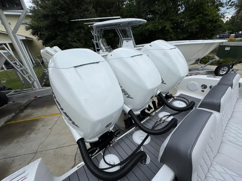 Slide: The Image of 2022 Fountain 38 CC boat with triple Mercury outboard engines. - 42