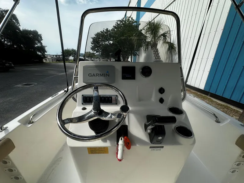 Slide: The Image of 2019 Key West 189FS boat console with Garmin navigation system and steering wheel. - 4