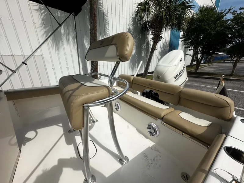 Slide: The Image of 2019 Key West 189FS boat interior with seating and Suzuki outboard motor. - 6