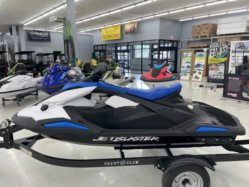 Slide: The Image of 2025 Yamaha WaveRunner JetBlaster displayed in a showroom, featuring sleek design and vibrant colors. - 0