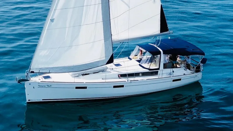 Slide: The Image of 2015 Beneteau Oceanis 45 sailing yacht on calm blue waters. - 10