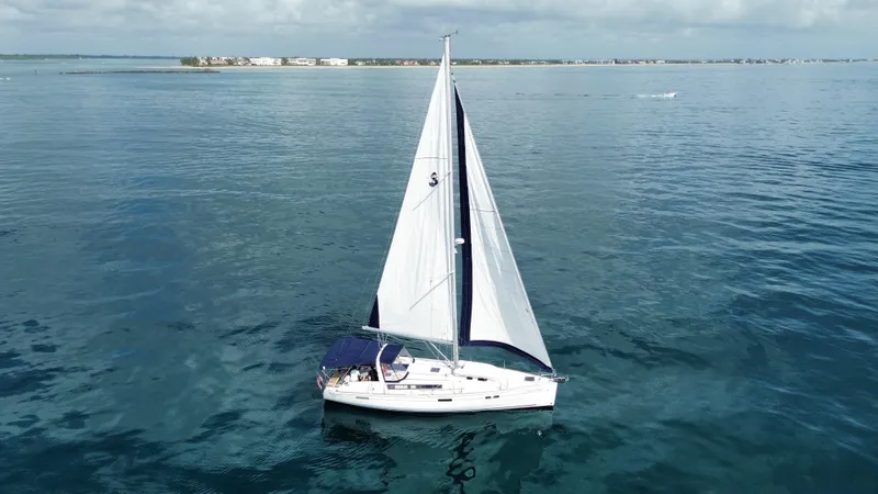 Slide: The Image of Sailing yacht Beneteau Oceanis 45, 2015 model, cruising on calm blue waters. - 14