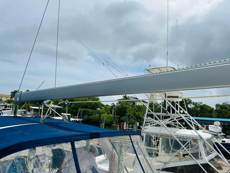 Slide: The Image of Beneteau Oceanis 45 sailboat, 2015 model, docked with visible rigging and canopy. - 33