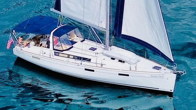 Slide: The Image of 2015 Beneteau Oceanis 45 sailboat cruising on clear blue water. - 4