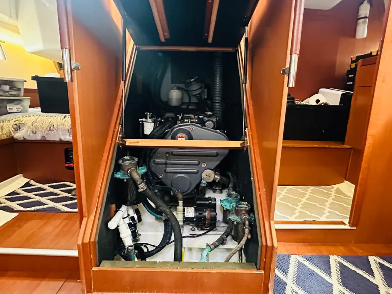Slide: The Image of Engine compartment of 2015 Beneteau Oceanis 45 sailboat, showcasing mechanical components. - 47