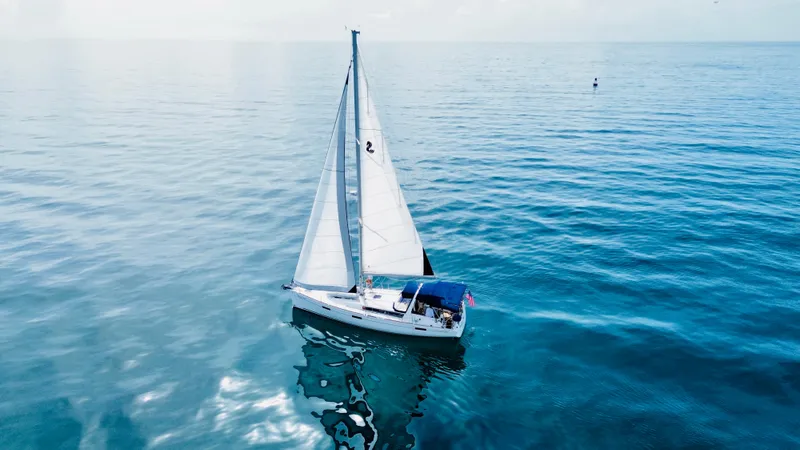 Slide: The Image of Sailing yacht Beneteau Oceanis 45, 2015 model, gliding on calm blue waters. - 5