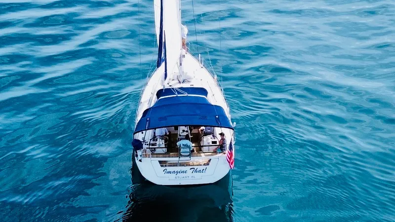 Slide: The Image of Beneteau Oceanis 45 sailboat on calm blue water, aerial view, 2015 model. - 6