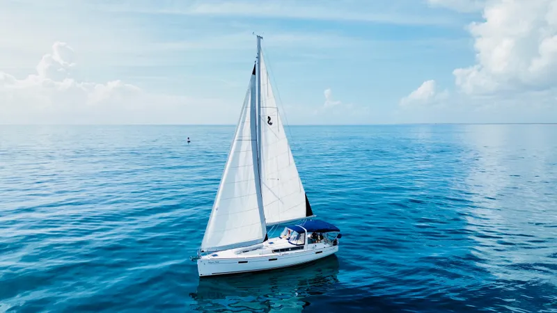 Slide: The Image of Sailing yacht Beneteau Oceanis 45, 2015 model, gliding on calm blue sea under clear sky. - 9
