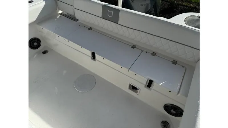 Slide: The Image of 2026 Sea Fox 248 Side Console boat interior with storage compartments and seating. - 11