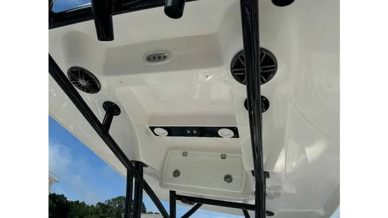 Slide: The Image of 2026 Sea Fox 248 Side Console boat interior with speakers and storage compartment. - 13