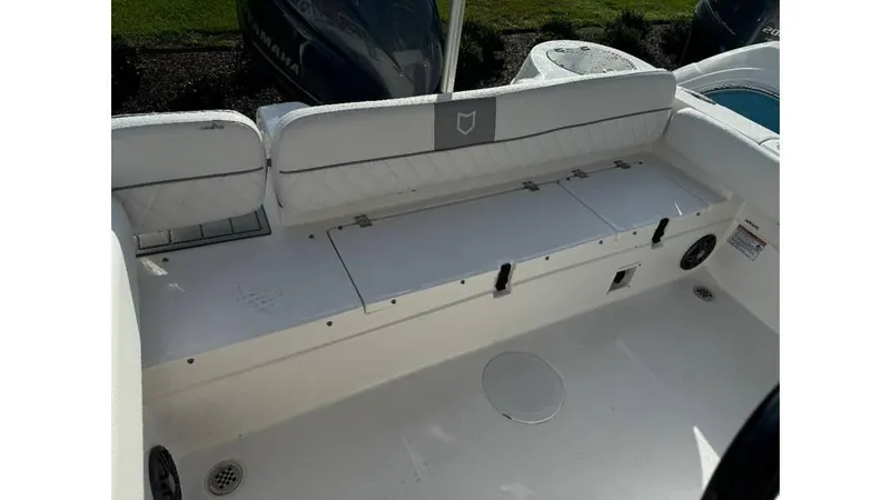 Slide: The Image of 2026 Sea Fox 248 Side Console boat interior with cushioned seating and storage compartments. - 14