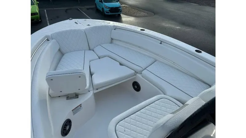 Slide: The Image of 2026 Sea Fox 248 Side Console boat with white cushioned seating in the bow area. - 7