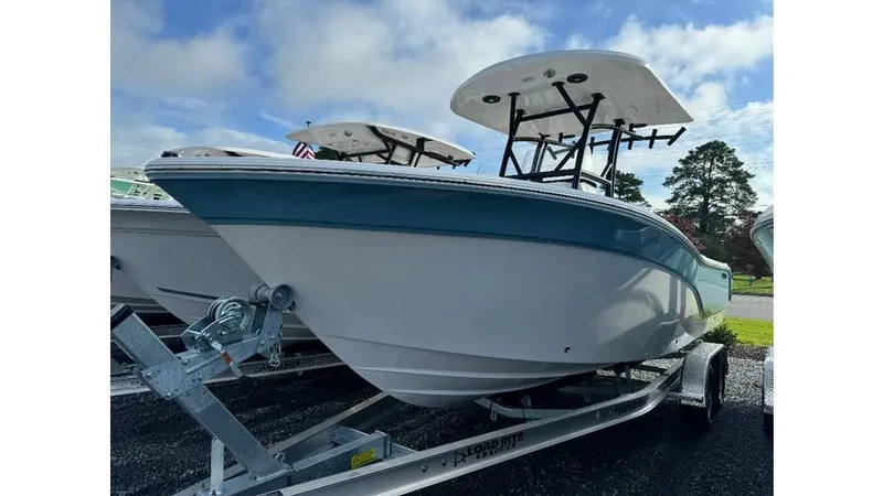 Slide: The Image of 2026 Sea Fox 248 Side Console boat on trailer, under a clear sky. - 8