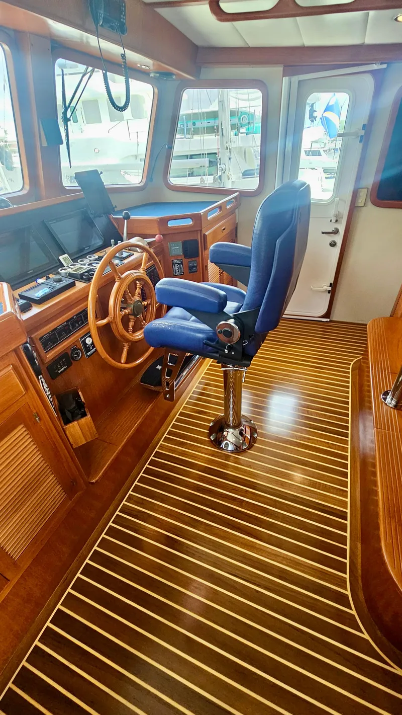 Slide: The Image of Interior of 2008 Kadey-Krogen 44 yacht with cozy seating and wooden table. - 11