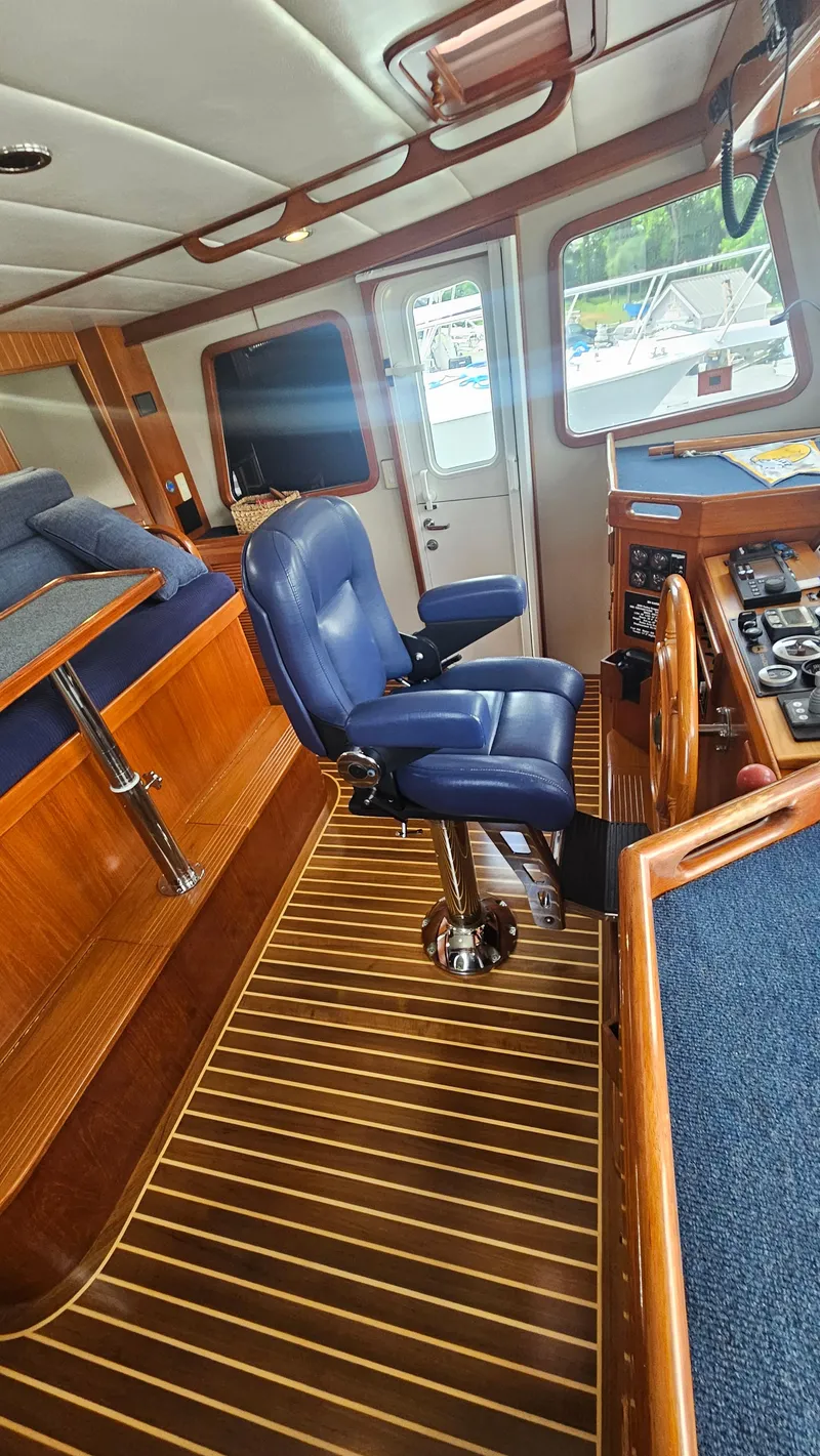 Slide: The Image of Luxurious 2008 Kadey-Krogen 44 yacht interior with elegant wood finishes and cozy seating area. - 14