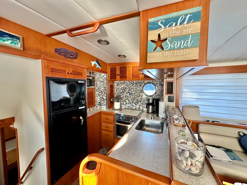 Slide: The Image of Interior of 2008 Kadey-Krogen 44 yacht with kitchen and cozy seating area. - 19