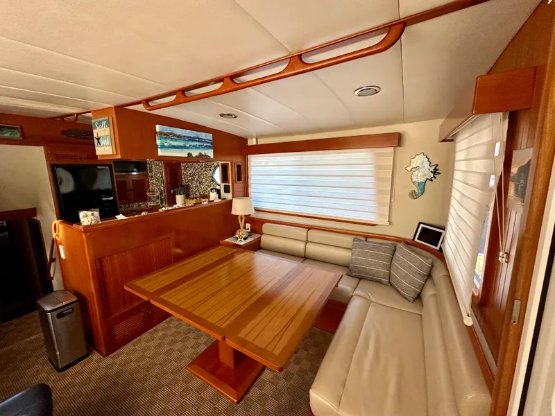 Slide: The Image of Pilothouse interior of 2008 Kadey-Krogen 44 yacht with wooden helm and blue captain's chair. - 25