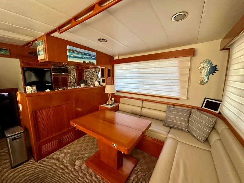 Slide: The Image of Pilothouse interior of 2008 Kadey-Krogen 44 yacht with blue seating and wooden accents. - 26