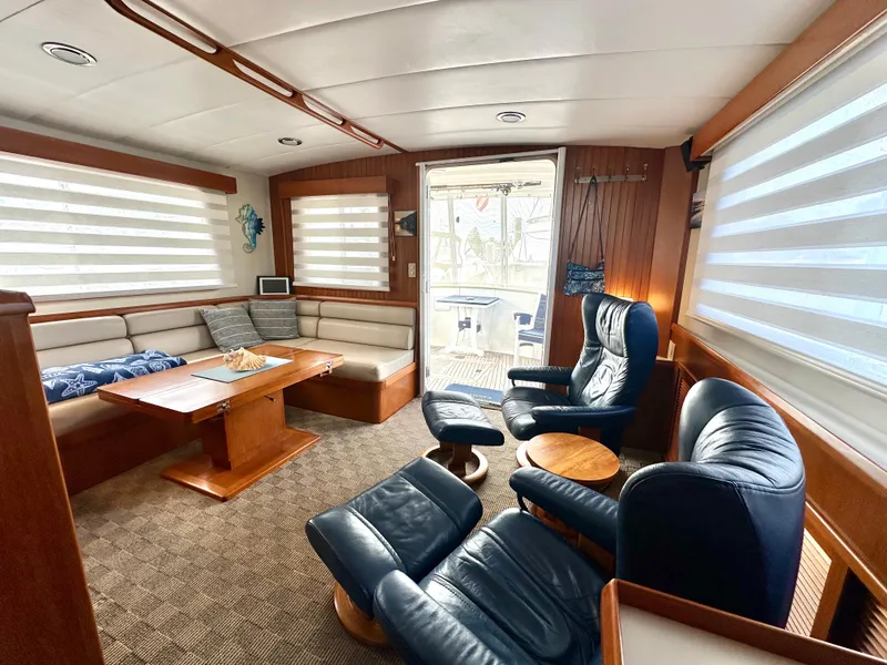 Slide: The Image of Luxurious 2008 Kadey-Krogen 44 yacht bedroom with wooden cabinetry and cozy bedding. - 33