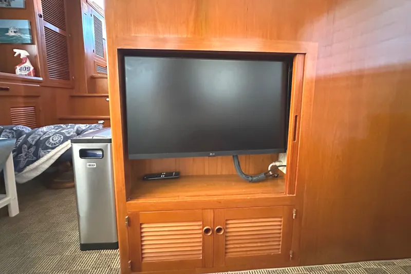 Slide: The Image of Luxurious 2008 Kadey-Krogen 44 yacht bedroom with elegant wood finish and cozy bedding. - 34