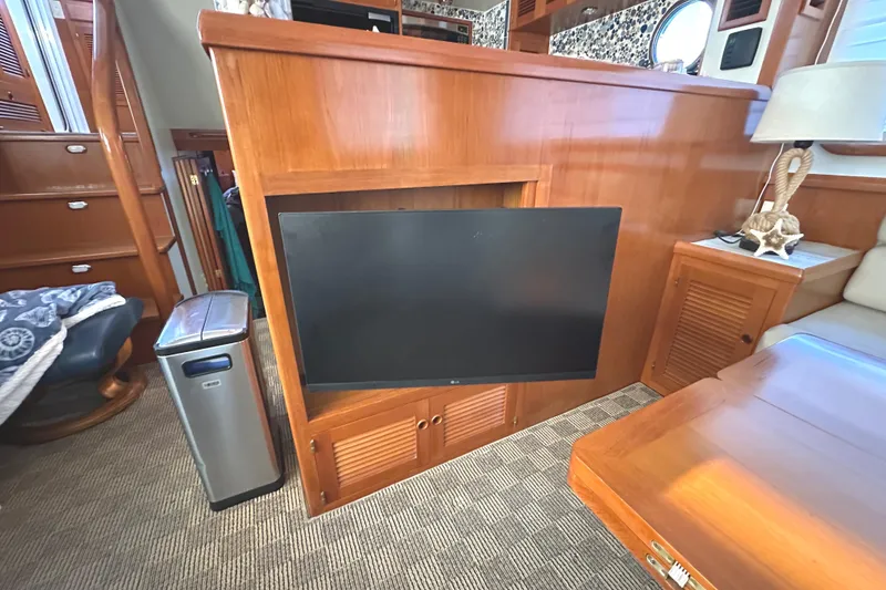 Slide: The Image of Luxurious 2008 Kadey-Krogen 44 bedroom with nautical decor and cozy bedding. - 35