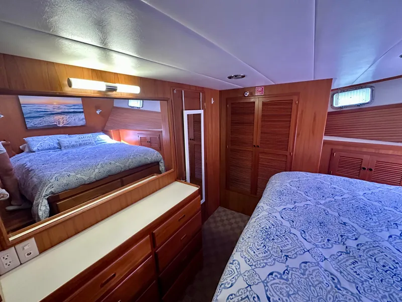 Slide: The Image of Cozy cabin interior of 2008 Kadey-Krogen 44 with blue seating and wooden accents. - 39