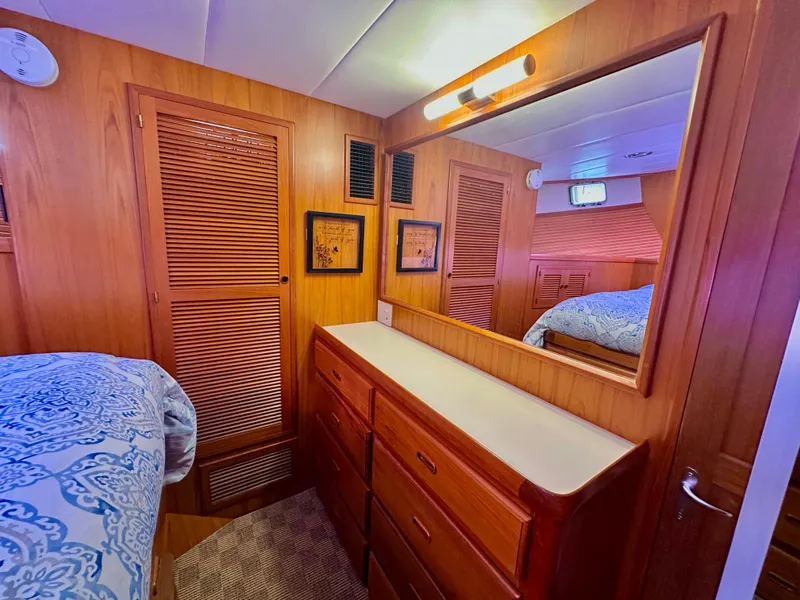 Slide: The Image of Cozy cabin interior of 2008 Kadey-Krogen 44 with blue cushions and wooden accents. - 40