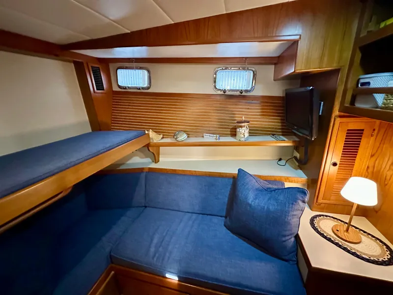 Slide: The Image of Luxurious 2008 Kadey-Krogen 44 yacht bathroom with shower, sink, and wooden cabinetry. - 44