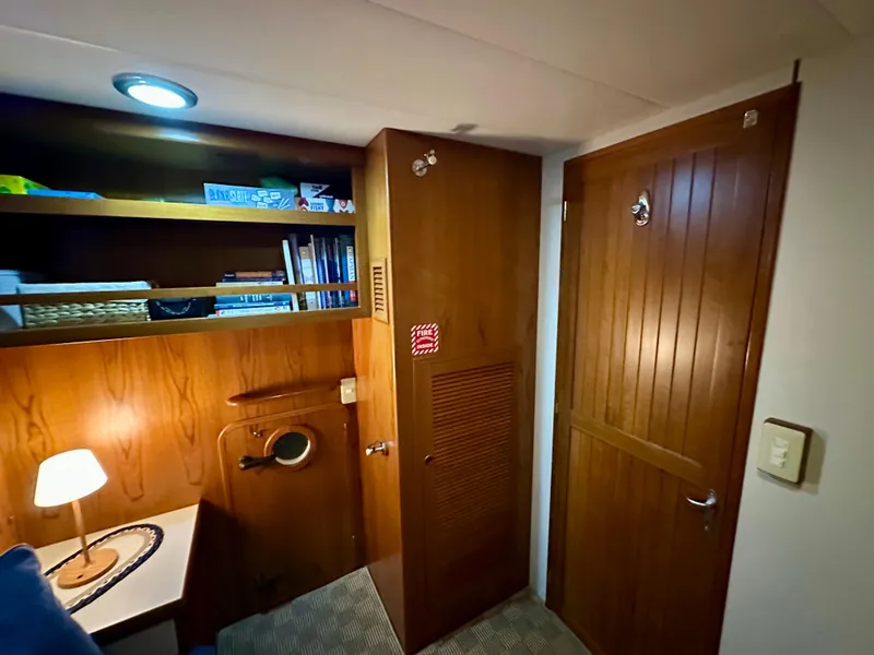 Slide: The Image of Bathroom vanity with wooden cabinets, mosaic backsplash, and round sink in a 2008 Kadey-Krogen 44. - 46