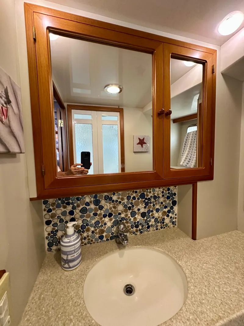 Slide: The Image of Engine room of a 2008 Kadey-Krogen 44 yacht, showcasing machinery and equipment. - 49