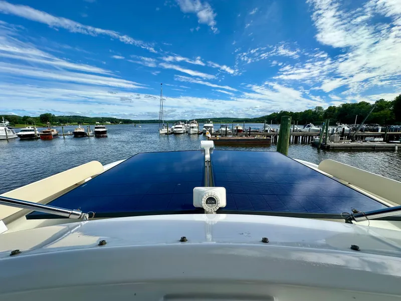 Slide: The Image of Helm of 2008 Kadey-Krogen 44 yacht with navigation equipment and striped seating. - 67