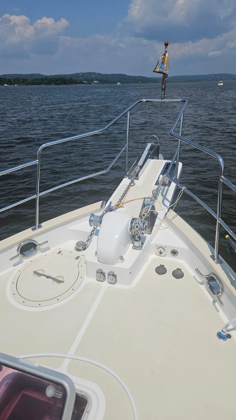 Slide: The Image of Docked Kadey-Krogen 44 yacht from 2008 with inflatable boat on deck. - 70