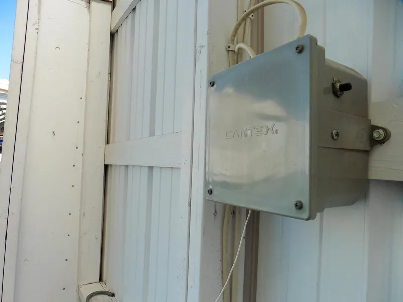 Slide: The Image of Electrical box on white boathouse wall, Cantex brand, Custom Boathouse #A138, 2012 model. - 10