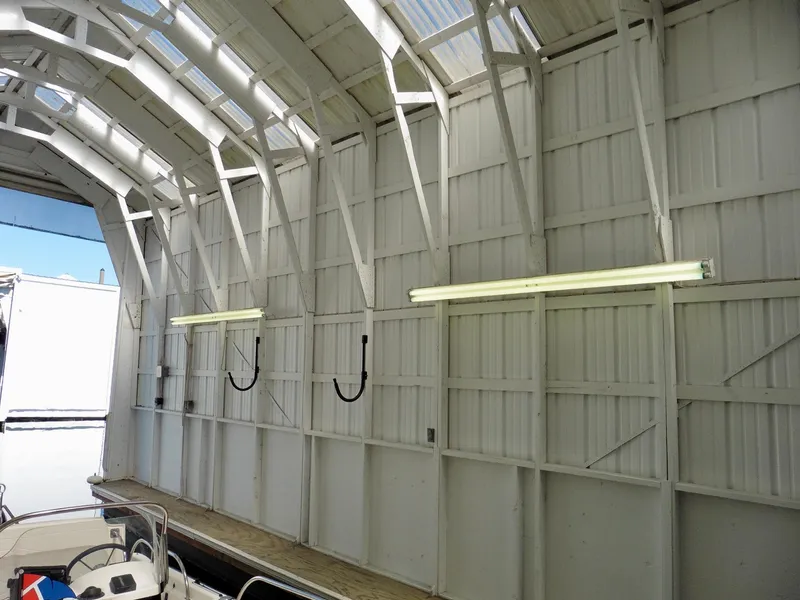 Slide: The Image of Interior of Custom Boathouse #A138, 2012, featuring white walls and fluorescent lighting. - 4
