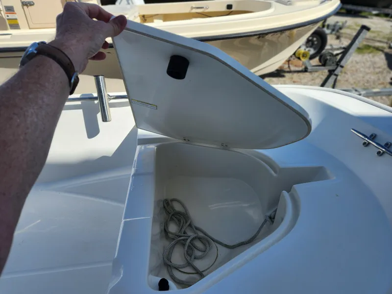 Slide: The Image of Open storage compartment on a 2011 Boston Whaler 130 Super Sport boat. - 7