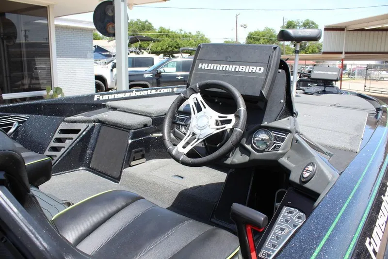 Slide: The Image of 2020 Skeeter FXR21 boat interior with Humminbird electronics and steering wheel. - 16