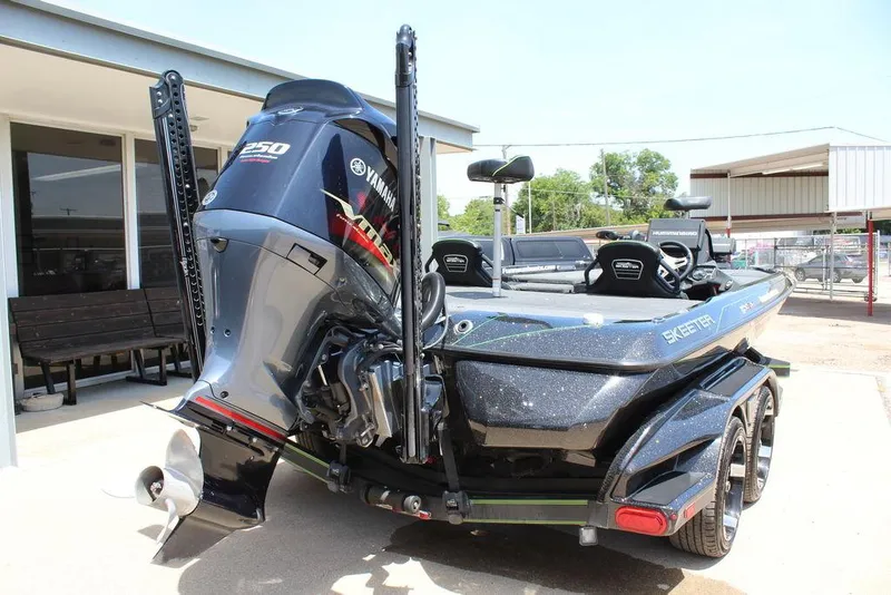 Slide: The Image of 2020 Skeeter FXR21 boat with Yamaha 250 engine, parked outdoors. - 5