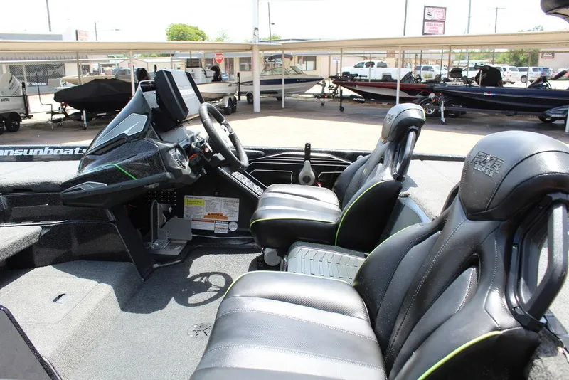 Slide: The Image of 2020 Skeeter FXR21 boat interior with sleek black seats and modern dashboard. - 9