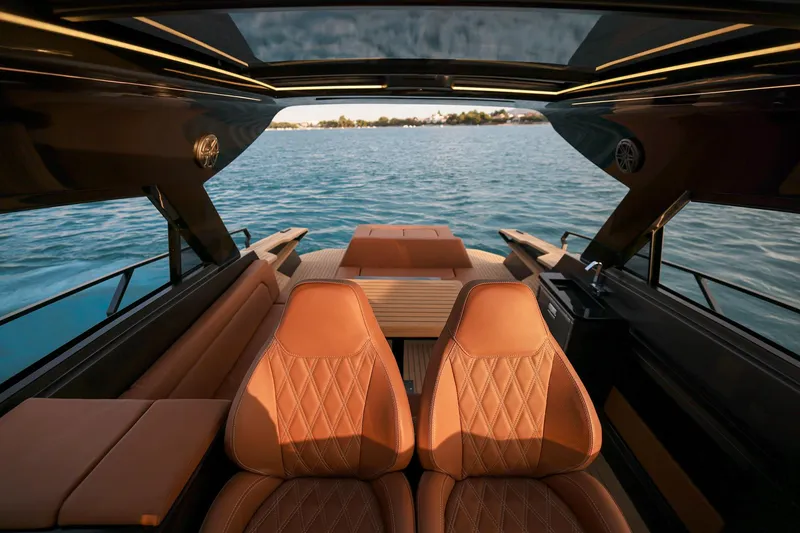 Slide: The Image of Luxurious interior of 2025 Focus 3X yacht with leather seating and panoramic water view. - 12