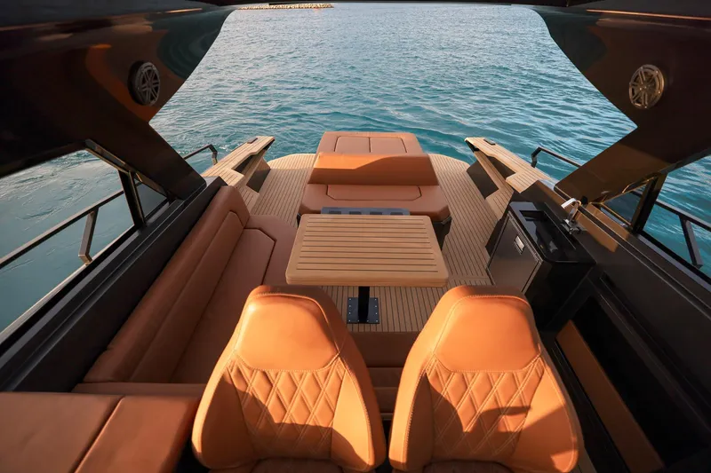Slide: The Image of Luxurious interior of 2025 Focus 3X yacht with leather seating and wooden table. - 13