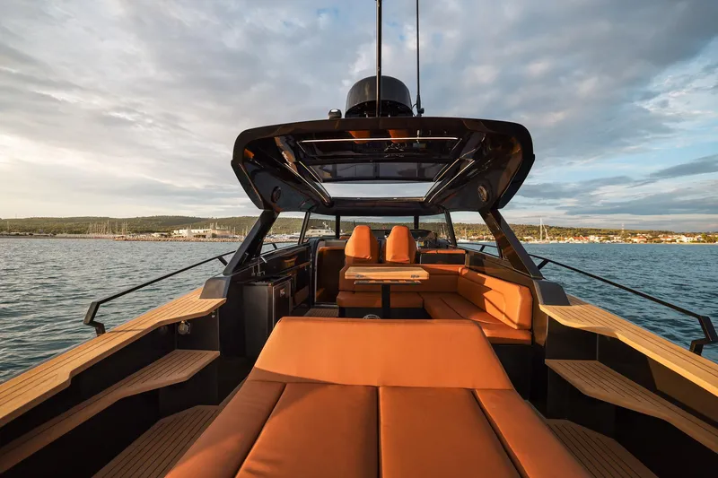 Slide: The Image of Luxurious 2025 Focus 3X yacht interior with elegant seating and scenic ocean view. - 19