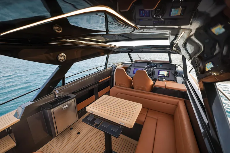 Slide: The Image of Luxurious interior of 2025 Focus 3X yacht with leather seating and modern navigation equipment. - 23