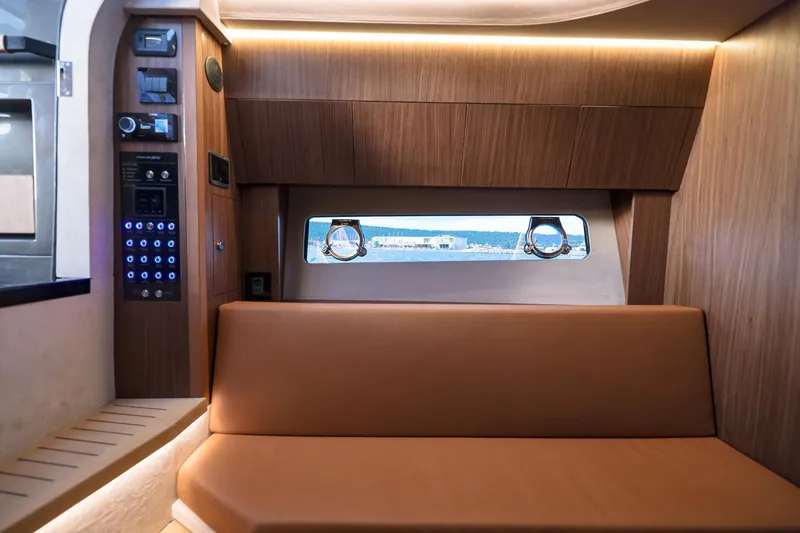 Slide: The Image of Luxurious interior of 2025 Focus 3X yacht with wood paneling and leather seating. - 32